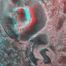 An aerial photograph of a crater with a red and blue overlay which slightly blurs the image.
